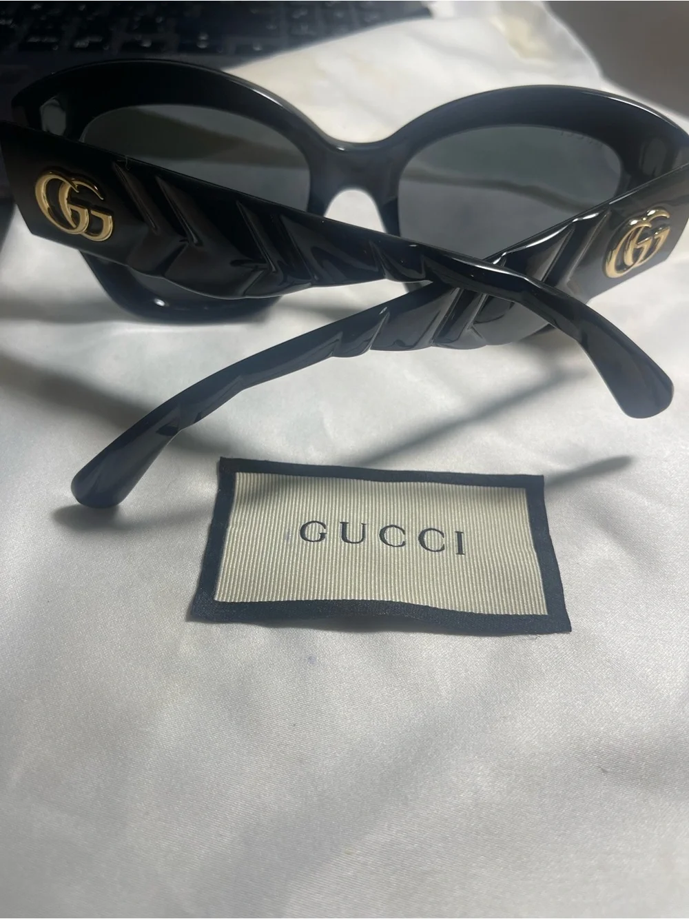 Gucci Black Round Sunglasses with Gold GG Emblem